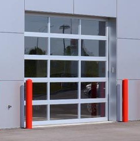 Glass Panel Overhead Door with Red Poles Next to It in Cleveland, OH